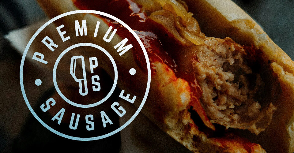 Premium Sausage badge made of an illustration of a meat cleaver in the shape of the province of Alberta